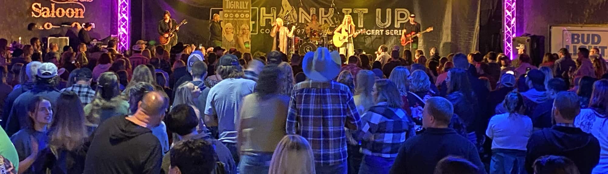 country concert with fans wearing cowboy hats Austin