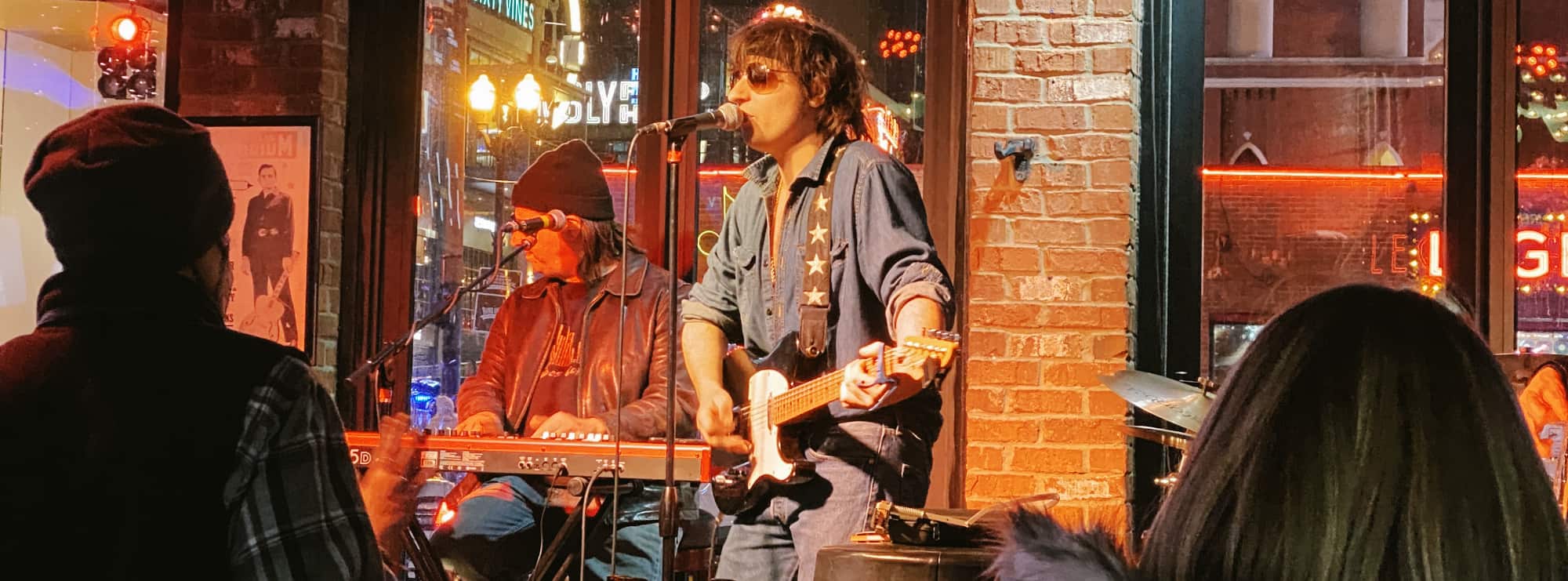 bar singer on guitar in Austin